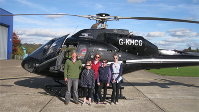 Camilla and her family with the helicopter