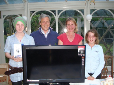 Camilla and her family with the TV