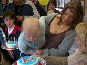 Oliver blows his candles out